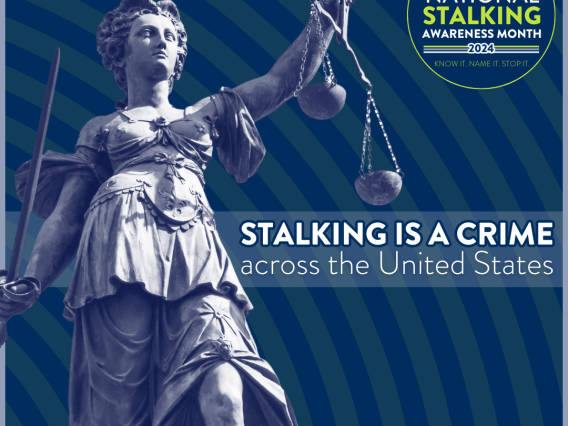 A statue of 'Justice' with text that reads 'Stalking is a crime across the United States.'